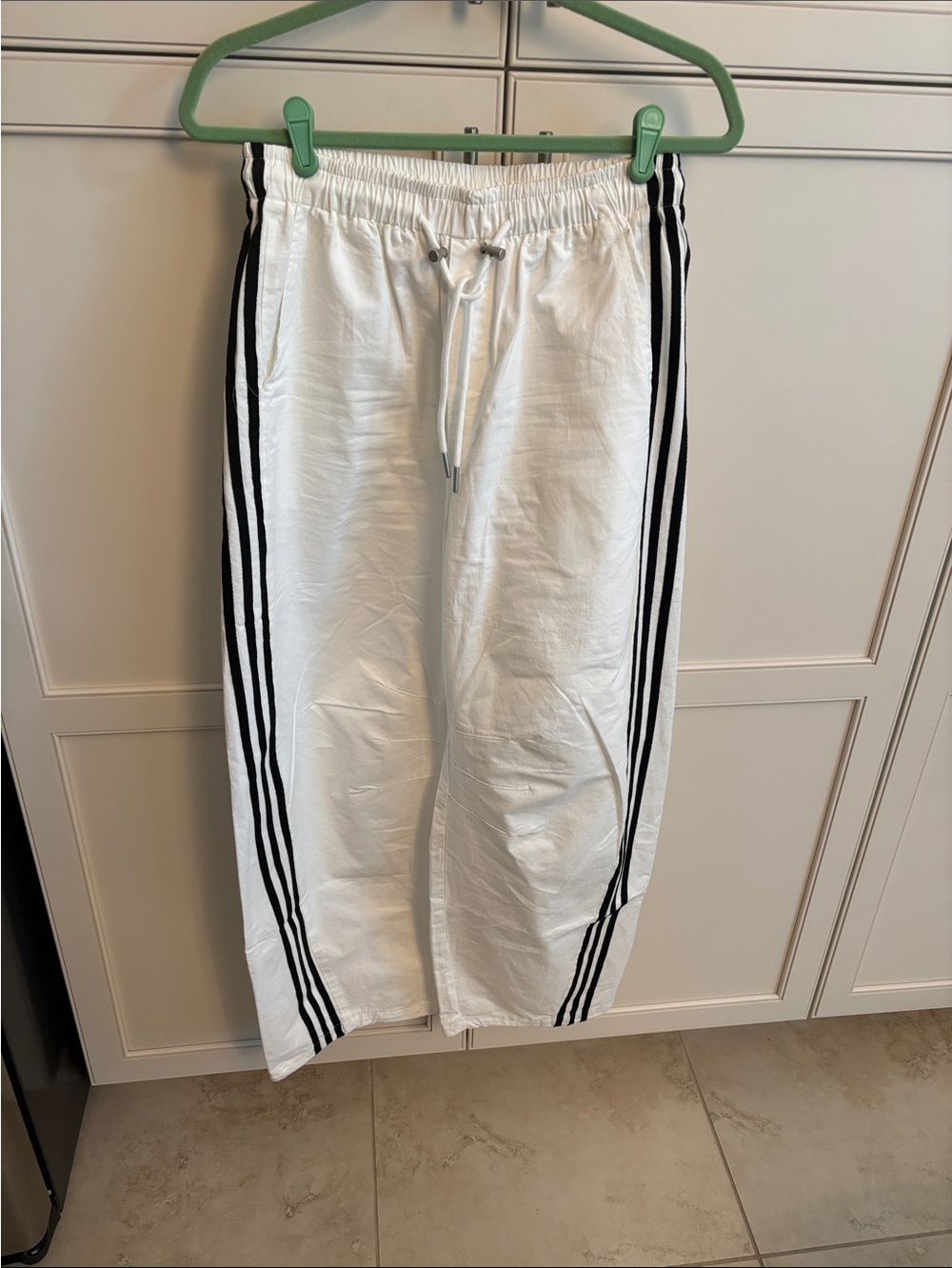 White Wide-Leg Track Pants with Black Side Stripes Barrel.
